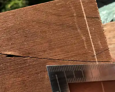 Showing splits in reclaimed wood piece.