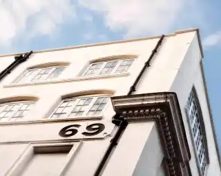 A building with a prominent number 69 on it.