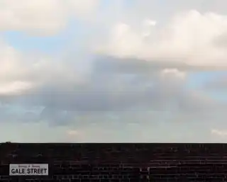 Top of wall with expanse of sky